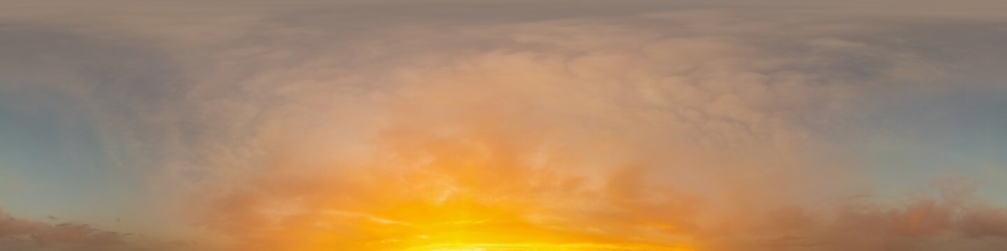 Golden glowing sunset sky panorama with Cirrus clouds. Hdr seamless spherical equirectangular 360 panorama. Sky dome or zenith for 3D visualization and sky replacement for aerial drone 360 panoramas.