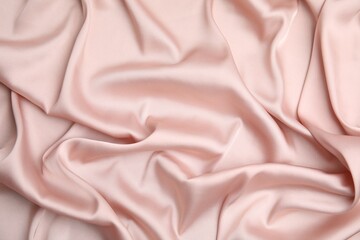 Texture of delicate pink silk as background, top view