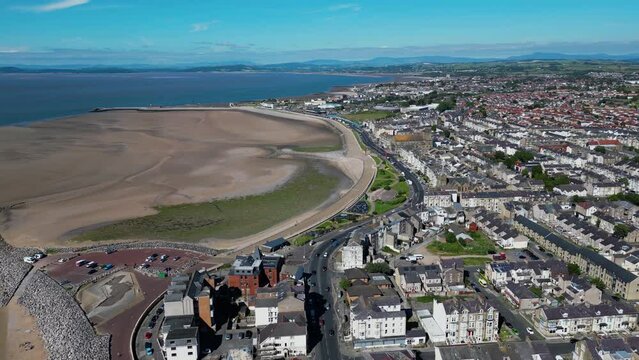4K: Aerial Drone Video of Morecambe Bay in Lancashire, UK. Approach shot with Beach & Jetty. Stock Video Clip Footage. Wide 