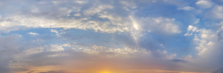 Naklejka na ściany i meble Colorful bright panorama sunset sky with clouds