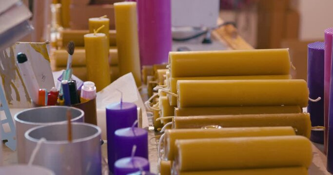 Wax candles picked up by woman hands close up