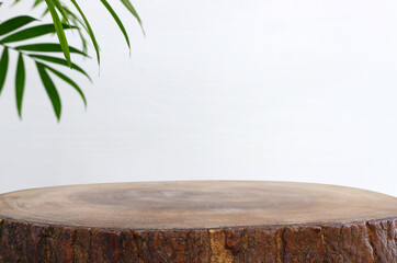 wooden table in front of interior wall and tropical green plant background. for product display and...