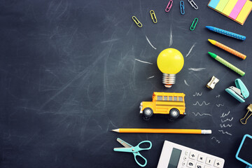 education. Back to school concept over wooden table and blackboard background