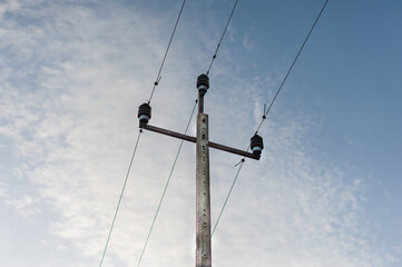 Old electric pole with sky