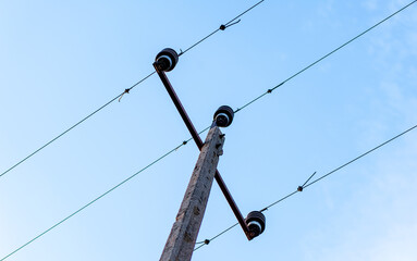 Old electric pole bottom view with sky