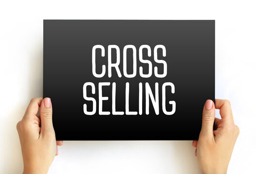 Cross Selling - action or practice of selling an additional product or service to an existing customer, text on card