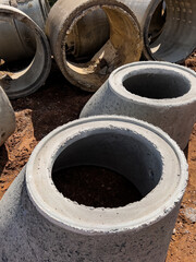 Concrete sewer pipes on building construction site