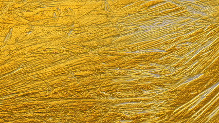 close up of golden scratched surface texture for backgrounds and wall papers and graphic design templates