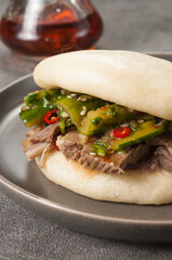 bao bun with beef and broken cucumbers
