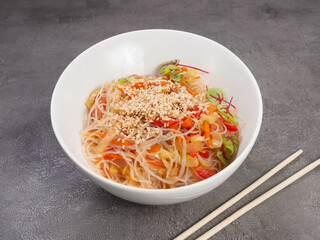 funchosa with vegetables is a hot Asian dish. concept: vegetarianism