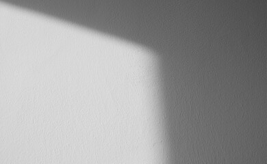 Abstract pattern of shadows by sunny beams on a wall as  texture or background