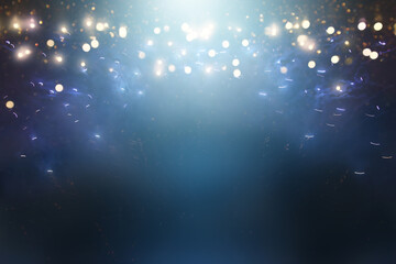 background of abstract black and blue glitter lights with fireworks. defocused