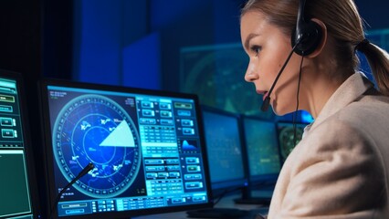 Workplace of the air traffic controllers in the control tower. Team of professional aircraft...