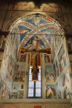 Crucifix and frescoes inside the basilica of San Francesco in Arezzo, Tuscany, Italy
