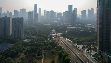 Obraz premium Aerial view of the new green urban landscape in the city. With noise cloud