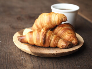 French butter croissants with a cup of black coffee