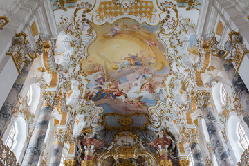 Steingaden, Germany - Nov 29, 2022: Paintings and decoration on the ceiling of the Wieskirche.