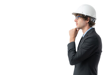 Side view of young business man in black suit protective construction helmet, keeping hand on chin thinking about question isolated on white background.
