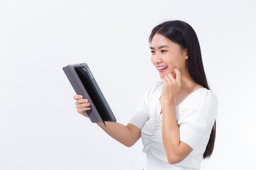 Fototapeta premium Asian woman in a white shirt looks happily at the tablet with a white background.