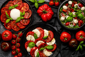 Diet and healthy tomato salads with arugula, cherry tomatoes, burrata, mozzarella cheese
