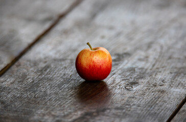 a close-up of an apple on a plank