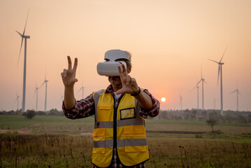 Portrait of engineer wearing yellow vest and white helmet using augmented reality application in...