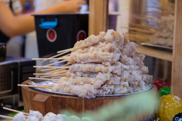 Raw fresh jellyfish skewer for grill eat with hot and spicy sauce,Appetizer meal seafood street food Thailand