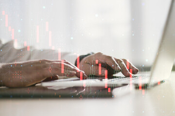 Creative concept of crisis chart illustration with hands typing on laptop on background. Global crisis and bankruptcy concept. Multiexposure