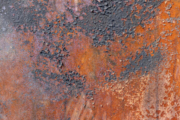 Rusty burnt metal of armored vehicles. metal texture with scratches and cracks
