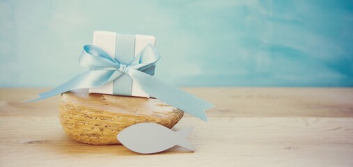 Gift box with fish as a symbol for confirmation, communion, baptism - greeting card or invitation	