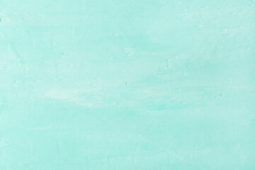 Concrete background in light turquoise color.