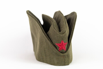Military cap. Yugoslavian army side cap with red star from the time of communism and world war era - obrazy, fototapety, plakaty