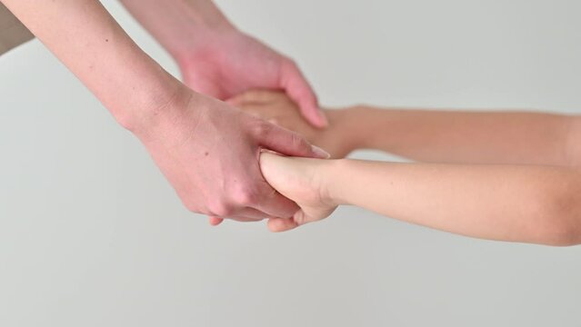 parent and child hands shake hands