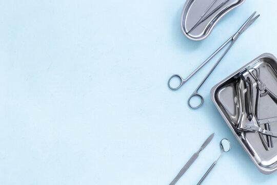 Dental Or Surgical Instruments In Steel Tray At Doctor Desk