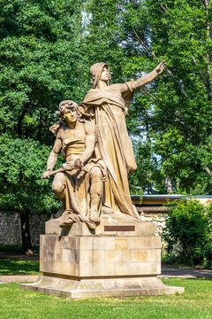 sculpture of slavic mythical figures - statues of Premysl and Libuse on pedestal in Vysehrad, Prague, Czech republic