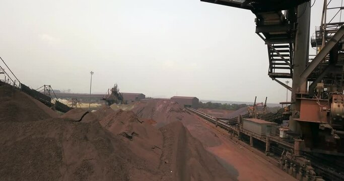 Working Stacker-Reclaimer Machine In The Coal And Iron Ore Stockyard Of Paradip Port Authority In Orissa, India. Forward Drone