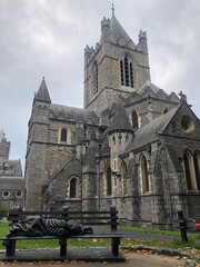 Fototapeta premium Christ Church Cathedral with a monument Homeless Jesus at the heart of Dublin, Ireland. Main Irish tourist attractions and best Ireland sightseeings. Medieval Irish architecture, old Irish cathedrals