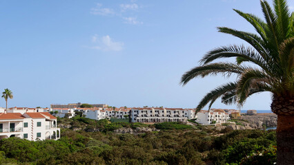 Fototapeta na wymiar Menorca (Minorca), Spain. Summer holidays apartaments in the west part of Menorca island. Cala Piques area, Los Delfines