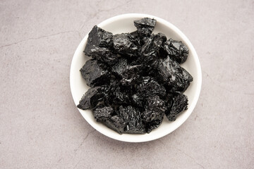 Shilajit is an ayurvedic medicine found primarily in the rocks of the Himalayas. selective focus