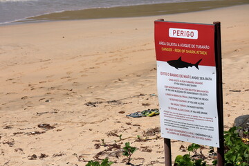 Shark attack advisor board at Praia do Sueste beach, Fernando de Noronha, Brazil, August, 10, 2022