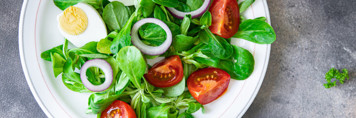 egg salad vegetable  tomato, onion, leaves lettuce green mix fresh healthy meal food snack diet on the table copy space food background 