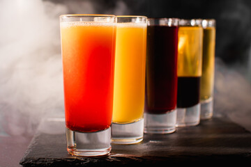 the bartender prepares an alcoholic cocktail
