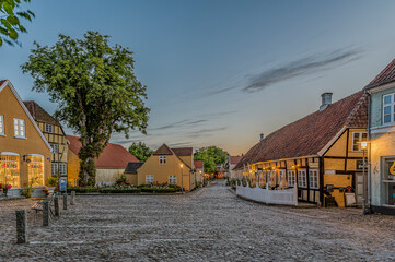 The square in the idyllic town Mariager in the dusk twilight hour