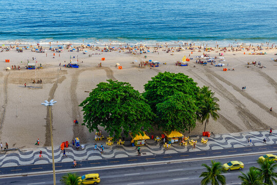 Sunset view of Copacabana beach and Avenida Atlantica in Rio de Janeiro, Brazil. Copacabana beach is the most famous beach of Rio de Janeiro. Skyline of Rio de Janeiro.