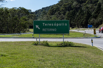 Road to Teres&oacute;polis, Rio de Janeiro, Brazil. Mountain region of the state. Signposts, cars on the highway. Region with a lot of nature. Sunny day