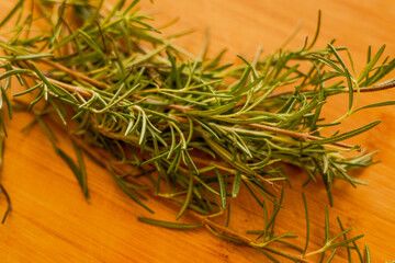 rosemary on wooden table. close up