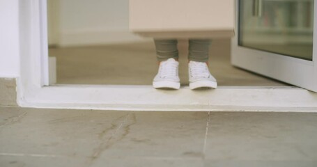 Customer with box delivery or package at house, property or home front door from online shopping ecommerce store. Woman with free shipping gift or stock from an internet e commerce shop or warehouse