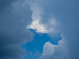 Obraz premium White fluffy clouds in blue sky for background