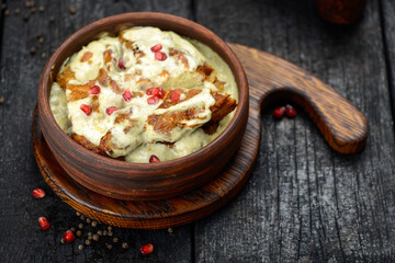 chicken fillet from cream sauce with pomegranate berries
