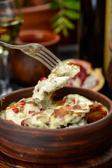 chicken fillet in cream sauce with pomegranate berries macro photo
